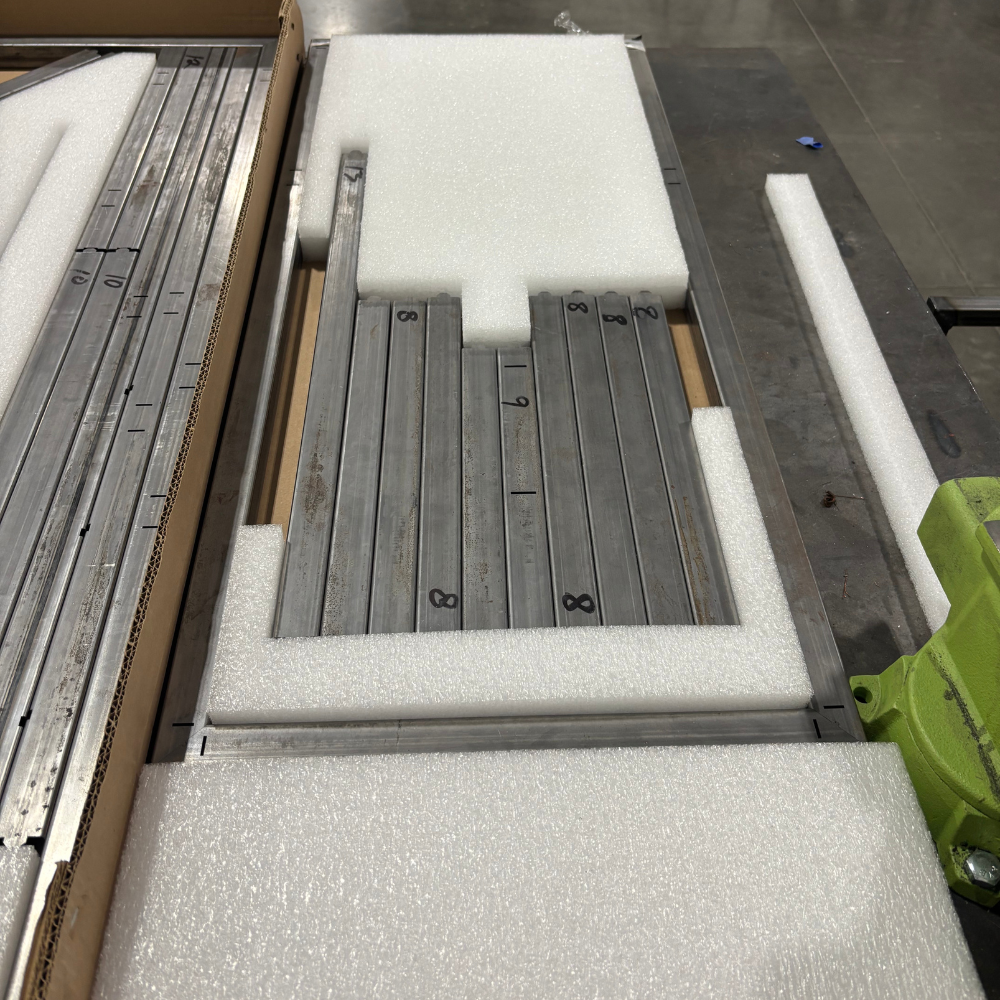 DIY welding cart steel frame parts organized and labeled in shipping box